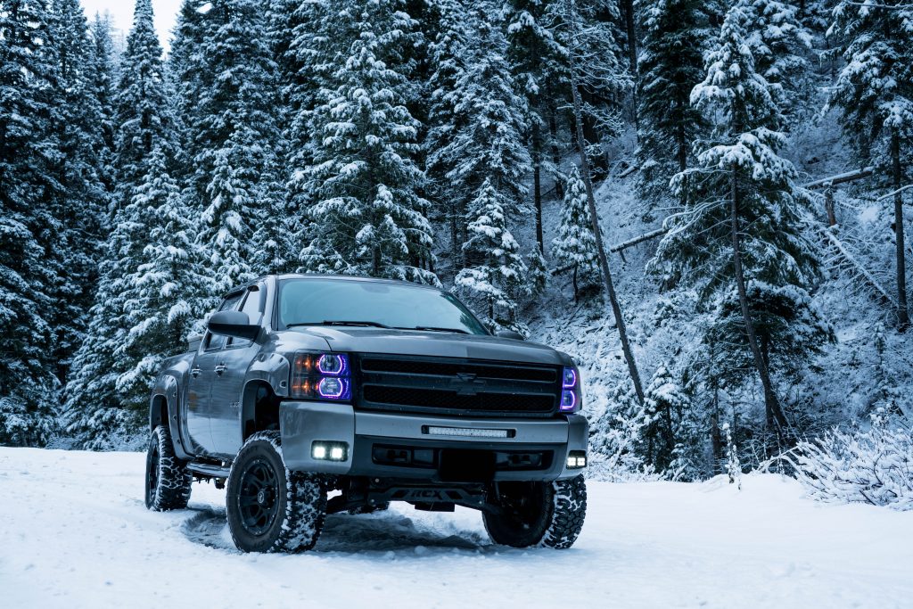 Black Truck in the snow needs an Engine Block Heater